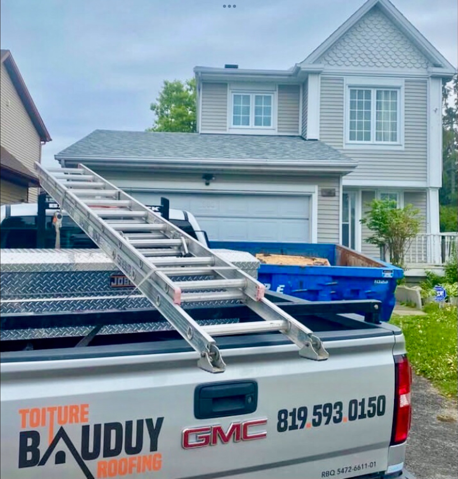 Older white couple smiling happy with the new roof repaired by Bauduy roofing